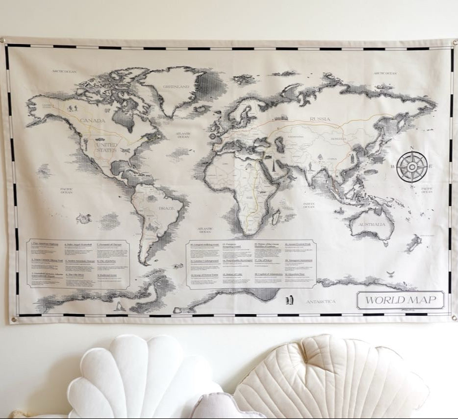 A beautifully designed cotton world map for children, 'Civilisational Achievements,' displayed on a wall. The map features labeled continents and countries, inspiring curiosity and learning about geography. Perfect for educational decor in a child's room